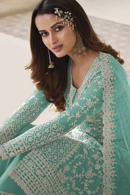 Turquoise embroidered net semi stitched straight palazzo suit. 2