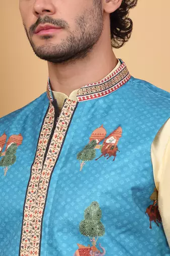 Silk blend beige kurta and churidar with ethnic motifs blue nehru jacket
