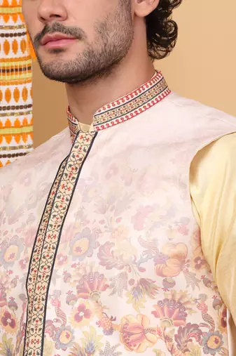 Silk blend beige kurta and churidar with floral printed beige nehru jacket