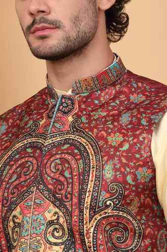 Silk blend beige kurta and churidar with paisley printed maroon nehru jacket