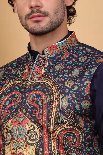 Silk blend navy blue kurta and churidar with paisley printed navy blue nehru jacket