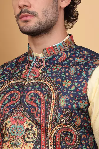 Silk blend beige kurta and churidar with paisley printed navy blue nehru jacket