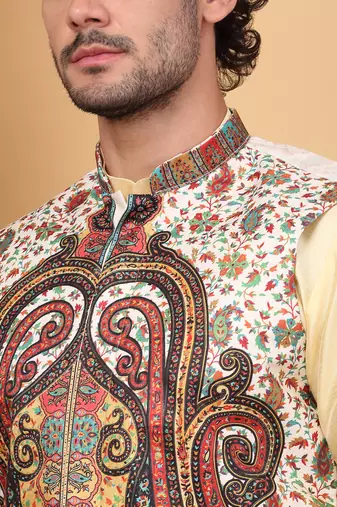 Silk blend beige kurta and churidar with paisley printed cream nehru jacket