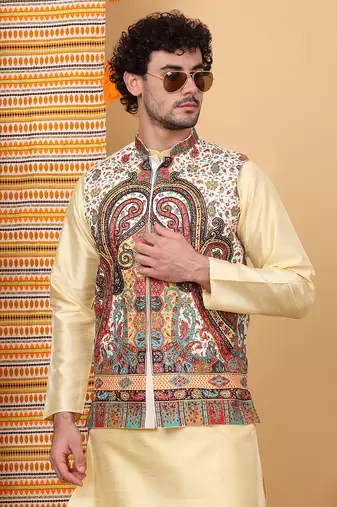 Silk blend beige kurta and churidar with paisley printed cream nehru jacket