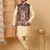 Silk blend beige kurta and churidar with paisley printed black nehru jacket
