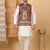 Silk blend cream kurta and churidar with paisley printed maroon nehru jacket