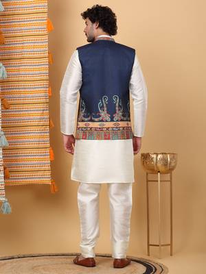 Silk blend cream kurta and churidar with paisley printed navy blue nehru jacket 3
