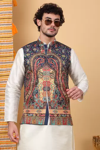 Silk blend cream kurta and churidar with paisley printed navy blue nehru jacket