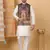 Silk blend cream kurta and churidar with paisley printed black nehru jacket