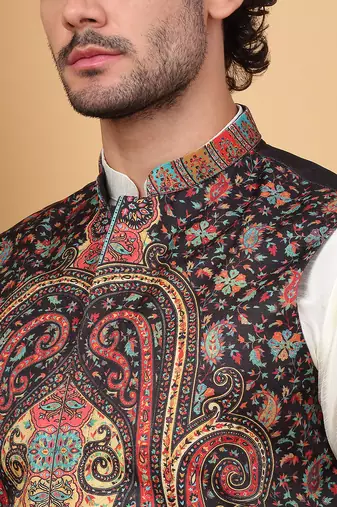 Silk blend cream kurta and churidar with paisley printed black nehru jacket