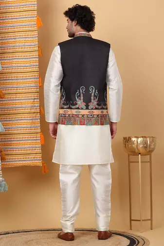 Silk blend cream kurta and churidar with paisley printed black nehru jacket