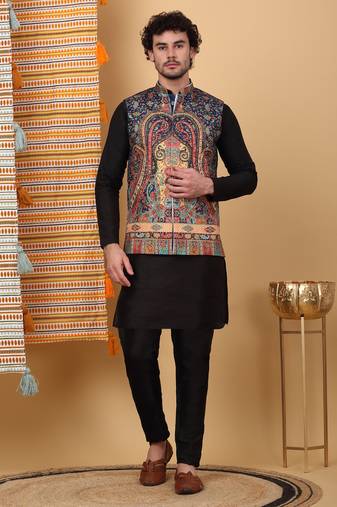 Silk blend black kurta and churidar with paisley printed navy blue nehru jacket