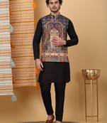 Silk blend black kurta and churidar with paisley printed navy blue nehru jacket