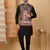 Silk blend black kurta and churidar with paisley printed navy blue nehru jacket