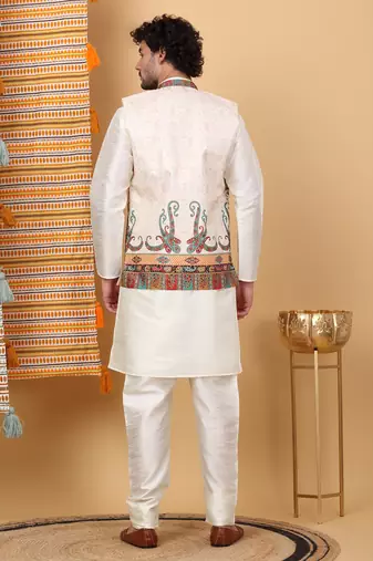 Silk blend cream kurta and churidar with paisley printed cream nehru jacket