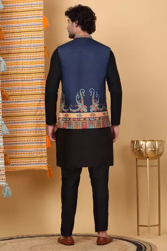 Silk blend black kurta and churidar with paisley printed navy blue nehru jacket
