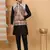Silk blend black kurta and churidar with paisley printed cream nehru jacket