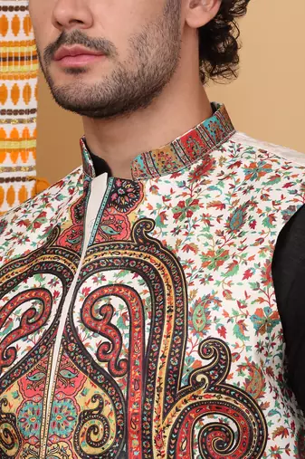 Silk blend black kurta and churidar with paisley printed cream nehru jacket