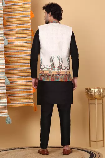 Silk blend black kurta and churidar with paisley printed cream nehru jacket