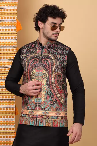 Silk blend black kurta and churidar with paisley printed black nehru jacket