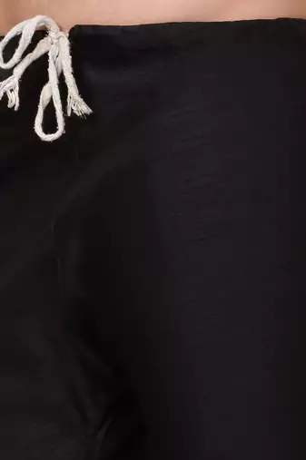 Silk blend black kurta and churidar with paisley printed black nehru jacket