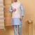 Silk blend sky blue kurta and churidar with embroidered cream nehru jacket