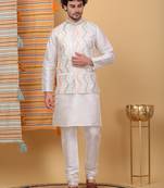 Silk blend cream kurta and churidar with embroidered cream nehru jacket