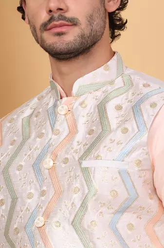 Silk blend peach kurta and churidar with embroidered cream nehru jacket
