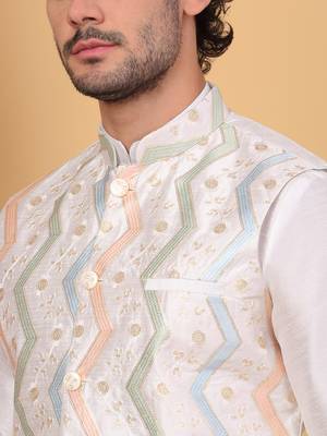 Silk blend cream kurta and churidar with embroidered cream nehru jacket 2
