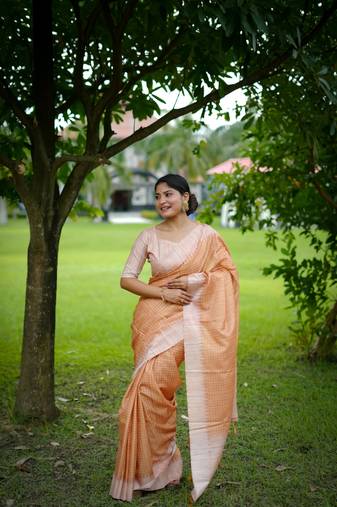 Peach soft tussar silk printed pattern and kanth weaving saree festive wear