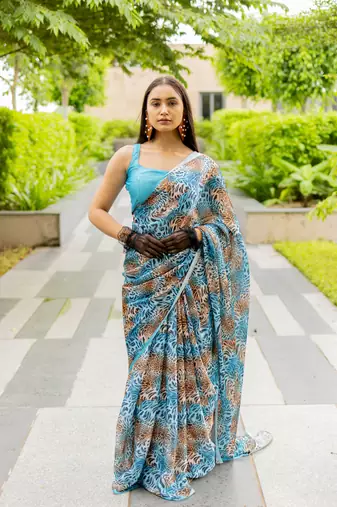 Turquoise blue satin georgette animal print plain saree with unstitched blouse piece