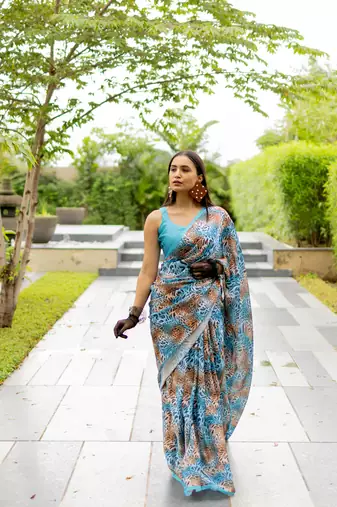 Turquoise blue satin georgette animal print plain saree with unstitched blouse piece
