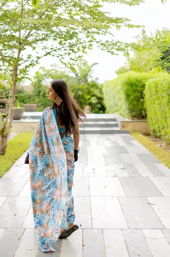 Turquoise blue satin georgette animal print plain saree with unstitched blouse piece