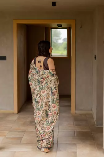 Cream satin georgette animal print floral print plain saree with unstitched blouse piece