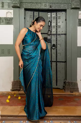 Dark turquoise chiffon bandhani print sequins lace border saree with unstitched blouse piece