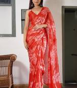 Coral red chiffon floral print saree with unstitched blouse piece