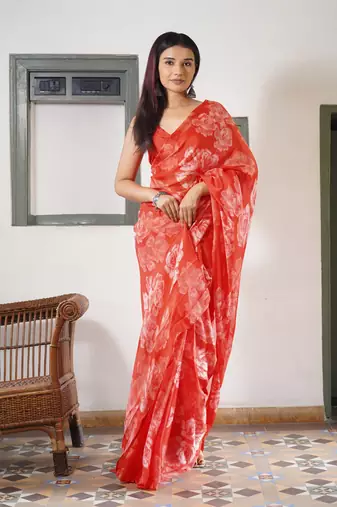 Coral red chiffon floral print saree with unstitched blouse piece
