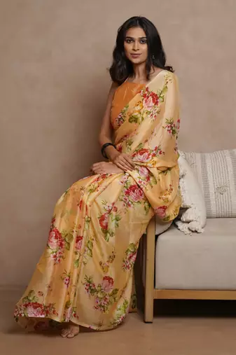 Pastel orange chiffon floral print saree with unstitched blouse piece