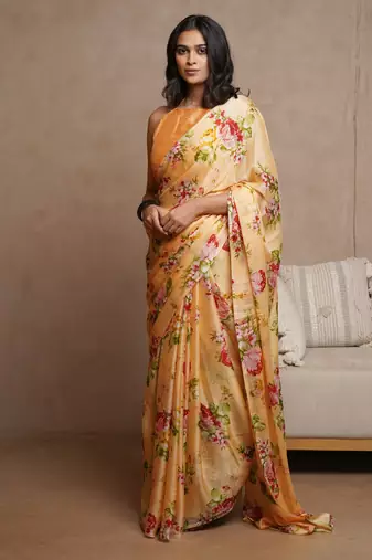 Pastel orange chiffon floral print saree with unstitched blouse piece