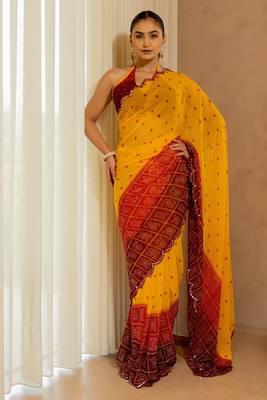 Orange georgette bandhani print plastic mirror work border saree with unstitched blouse piece 1