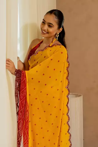 Orange georgette bandhani print plastic mirror work border saree with unstitched blouse piece