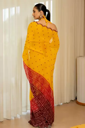 Orange georgette bandhani print plastic mirror work border saree with unstitched blouse piece