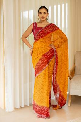 Orange georgette bandhani print stone work stone work border saree with unstitched blouse piece 1