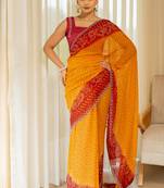 Orange georgette bandhani print stone work stone work border saree with unstitched blouse piece
