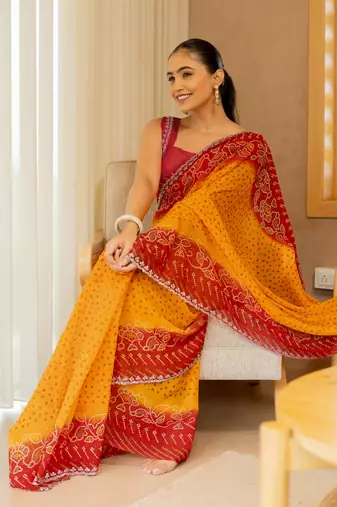 Orange georgette bandhani print stone work stone work border saree with unstitched blouse piece
