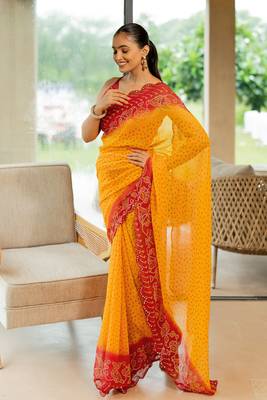 Orange georgette bandhani print stone work border saree with unstitched blouse piece 4