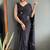 Black designer hand printed faux georgette saree with blouse piece