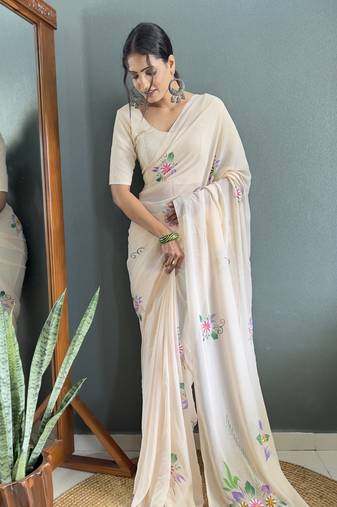 Cream designer hand printed faux georgette saree with blouse piece