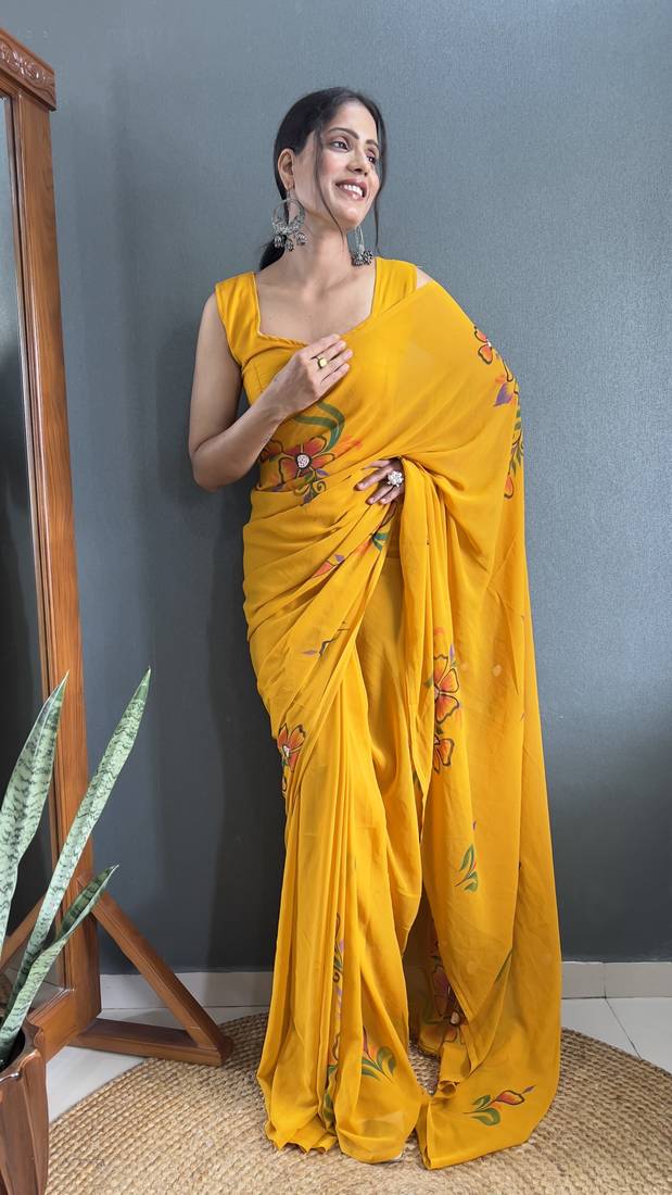 Mustard designer hand printed faux georgette saree with blouse piece