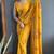 Mustard designer hand printed faux georgette saree with blouse piece